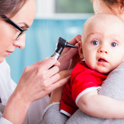 Nurse practitioner giving a HEENT exam